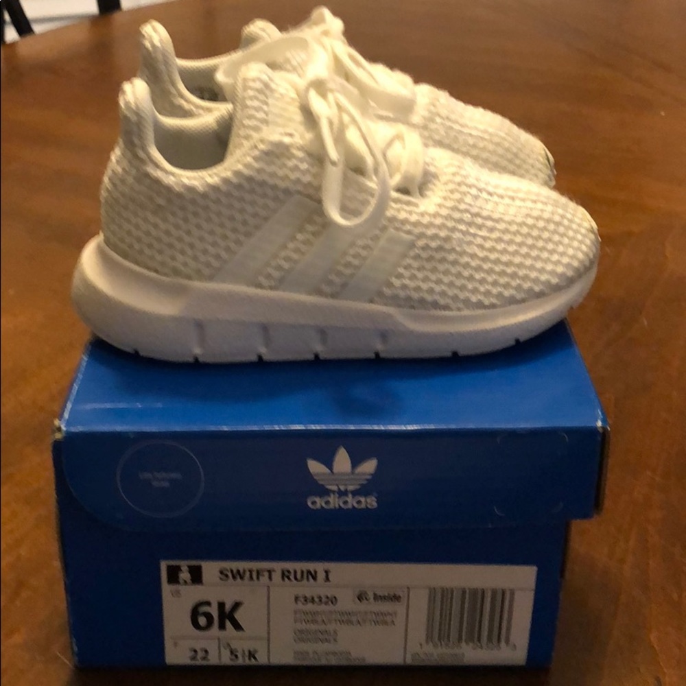 Toddler Swift Run 1 tie-up sneakers.